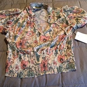 Short sleeve, sheer, floral blouse.